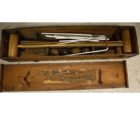 A croquet set in a pine box with Harrods mallets, bears label to the underside of the lid inscribed "United Service Croquet S