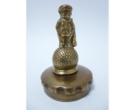 VINTAGE CAR MASCOT-DUNLOP GOLF CADDY figure standing on a Dunlop 31 stamped golf ball, circa 1930s, 9cms H.