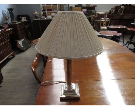 A silver plated column form lamp, 50cm tall with shade