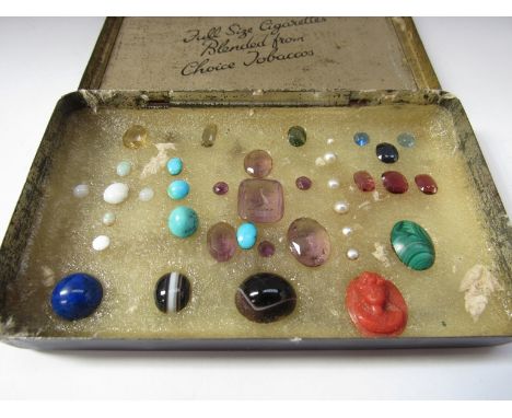 A collection of loose gemstones including Intaglio amethyst, turquoise, opals, peridot and banded agate etc