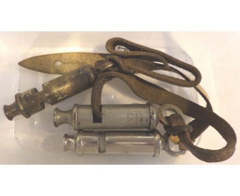 Three vintage whistles all with stamped military arrow 