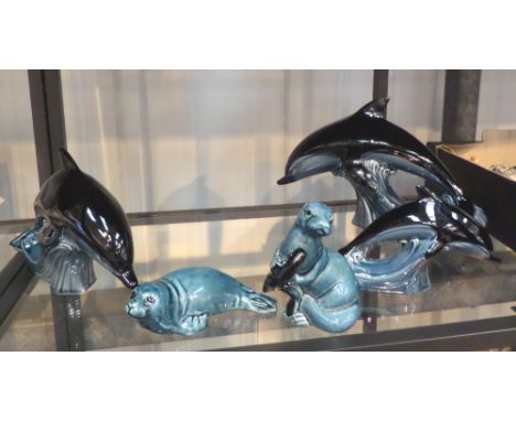 Poole Pottery three dolphins, seal and otter, large dolphin A/F