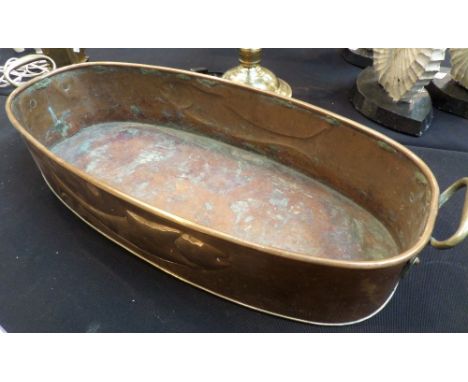 Large antique copper fish kettle with embossed fish design, possibly Newlyn