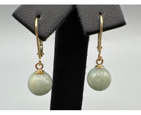 Ladies 14ct gold light green Jade ball drop earrings. 2.7g