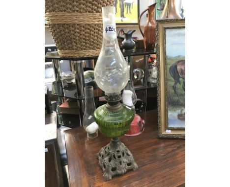 A Victorian oil lamp with cast base, small oil lamp & spare funnel ****Condition report**** Fair to good condition with no da