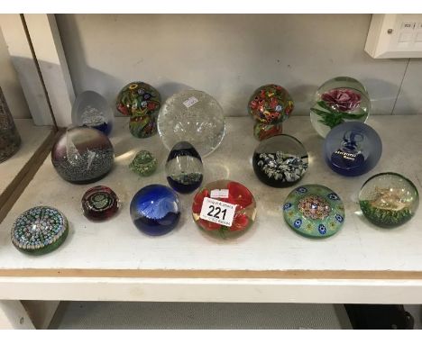 A quantity of glass paperweights including Caithness