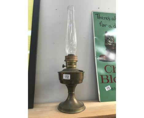 A brass oil lamp with chimney