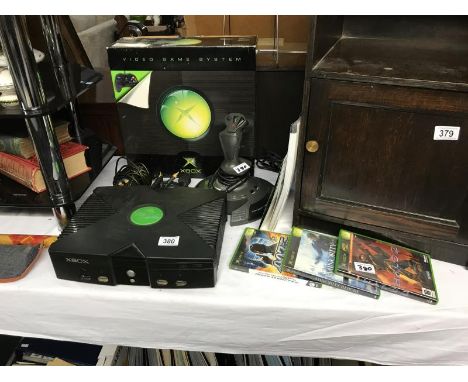 An X-Box game system, Fox 2 pro flight stick compatible with X-Box and games