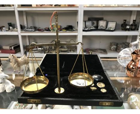 A boxed balance scales