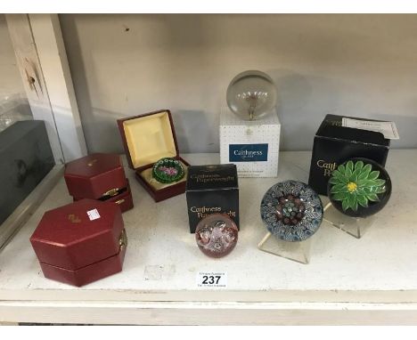 A quantity of mainly boxed glass paperweights, including Caithness and Perthshire paperweights