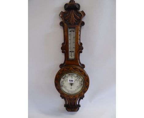 Carved oak case aneroid barometer