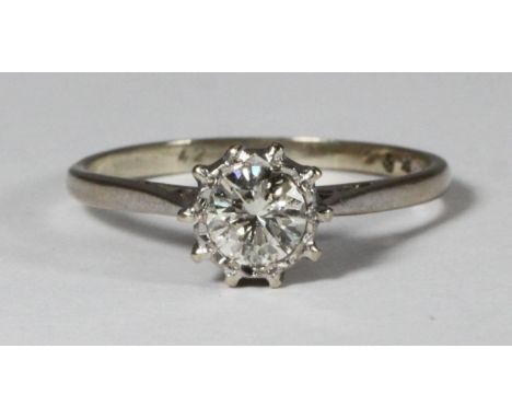 An 18ct white gold solitaire diamond ring, claw-set, RBC diamond, estimated 0.85 carats, item weight 3.2 grams, gilt-tooled b