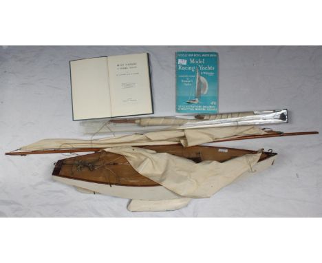 A scratch-built model pond yacht, with planked deck and brass fittings, together with additional sails and two model yacht bo