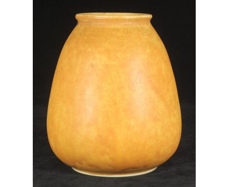 A Ruskin pottery vase of tapering cylindrical form, finished in a mottled light yellow/beige glaze, 16cm tall 