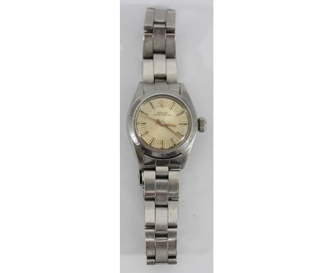 A ladies stainless steel Rolex Oyster Perpetual wristwatch, model 6718, c.1976, the champagne dial with applied gold batons d