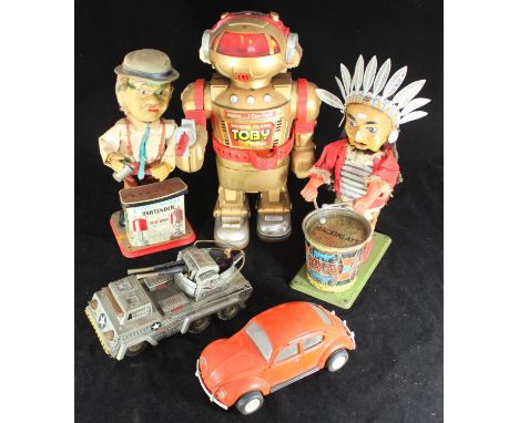 A tinplate tank with driver together with a battery operated 'Charley Weaver Bartender', Mackinlay's drumming Red Indian, Ton