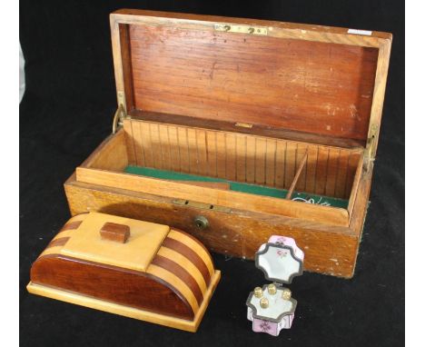 An Art Deco cigarette box, of domed form, with striped design, together with an Army &amp; Navy oak box and a small German po
