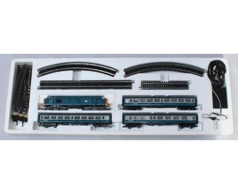 A Hornby Railways Electric Train Set model no. R825-9140 00-511 with loco, three carriages, power pack, track, instructions a