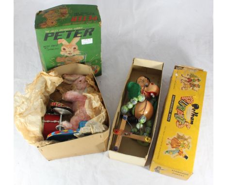 A boxed Pelham 'Baby Dragon' puppet, together with a boxed 'Peter The Jolly Drumming Bunny' figure 