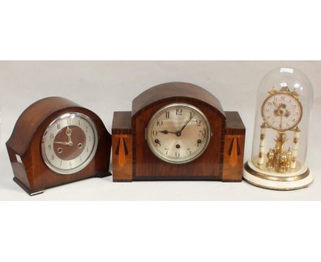 A German anniversary clock with glass dome, together with an Art Deco walnut mantel clock and a 1920s mantel clock (3) 