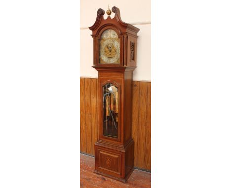 An Edwardian mahogany chiming longcase clock by Bruford &amp; Son, Exeter, with eight-day movement, striking the hours on a g