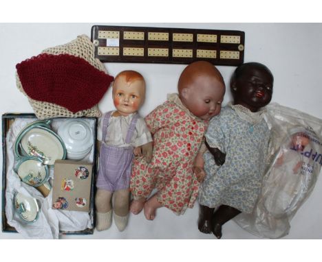 Two Armand Marseille dolls, 362/5k and 351/6k, another German porcelain headed doll, a child's porcelain tea set and a cribba