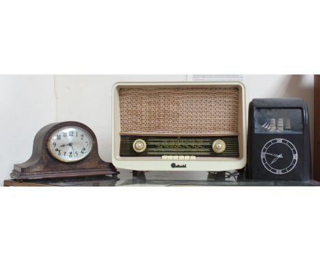 A 1930s Vitascope electric novelty 'maritime" clock with pitching square-rigged ship feature, together with an oak mantel clo