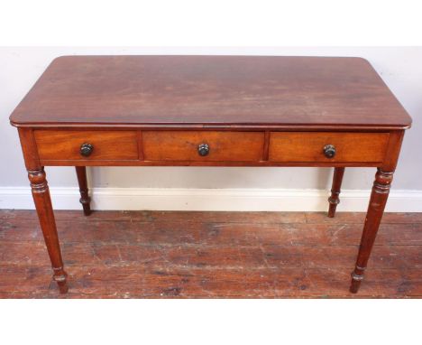 A stained walnut hall table with frieze drawers and faux frieze drawers to either side, all with turned pulls, 121cm, togethe