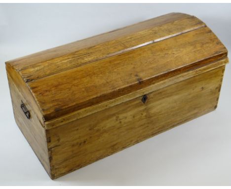 A DOME TOPPED PINE TRUNK with metal handles and escutcheon, 90cms wide (BBC Bargain Hunt)