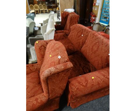 A good quality lounge suite comprising two-seater sofa, two wingback armchairs in a red two-tone cotton velour pattern