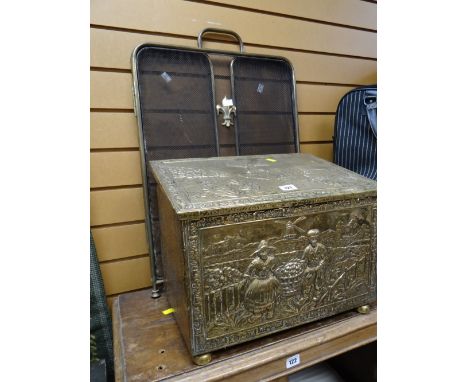 A sloped brass coal box & fleur-de-lys fireguard