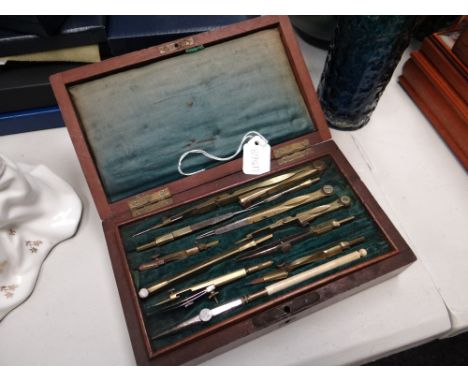 A vintage cased set of technical drawing instruments
