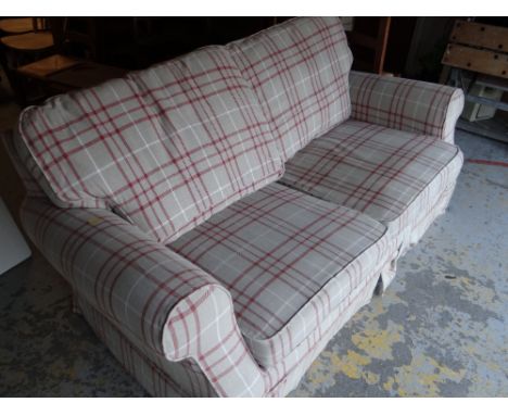 A tartan upholstered sofa bed