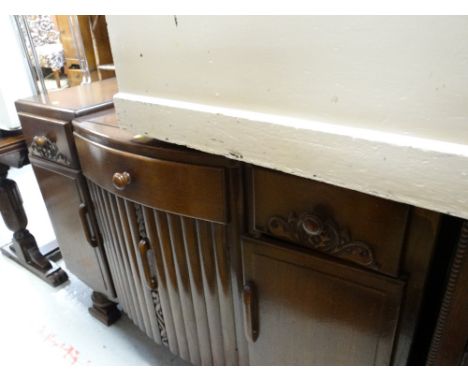 A vintage carved convex sideboard