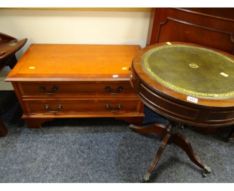 A reproduction drum-top side table with green leather tool top together with a reproduction yew TV / hifi cupboard