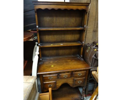 A compact reproduction kitchen dresser
