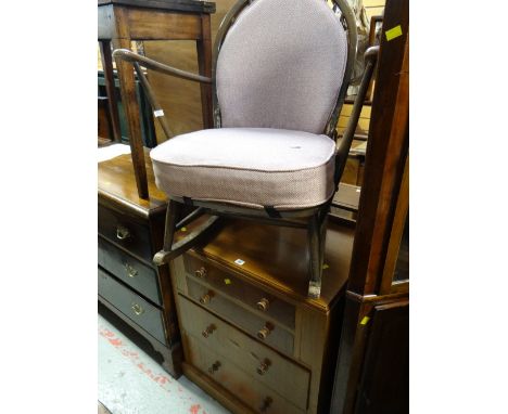 A vintage four-drawer chest & upholstered rocking chair
