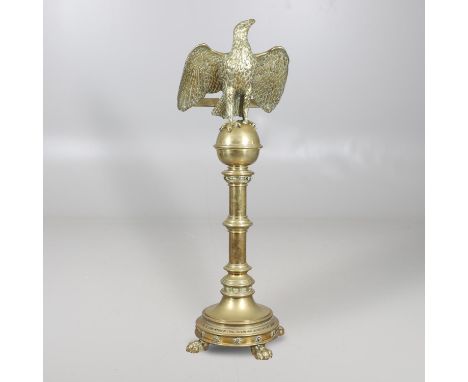 the realistically cast eagle forming the bible rest, it's claws on a cup and cover, the ringed cylindrical column with bands 