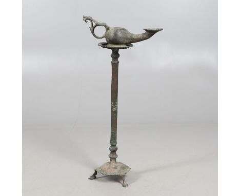 A large bronze Roman oil lamp with long spout, globular body with opening to the top and heart shaped handle mount, height12 