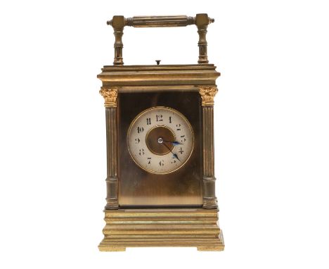 the silvered chapter ring with Arabic numerals, the brass case with Corinthian columns to the corners and a stepped base, the