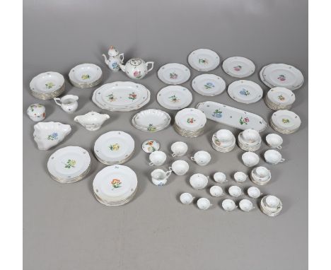 A large tea and dinner service in the 'Gustav' design, each painted with a central flower and further flowers. The dinner ser