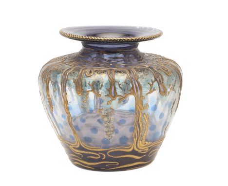 An interesting art glass vase of purple colour with blue roundels, overlaid in gilt with foliage. With an etched signature to