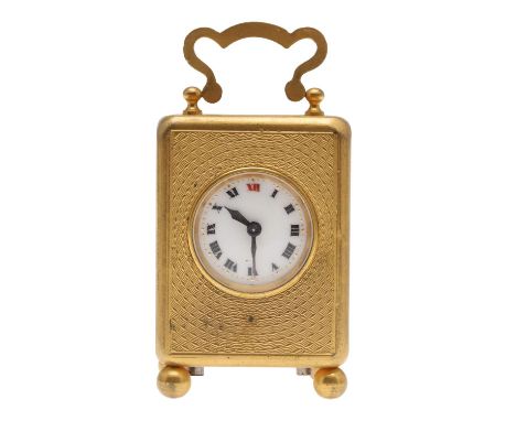late 19th/early 20th century, the case with carrying handle and engine turned decoration, upon ball feet, height 6.5cm.  *CR 