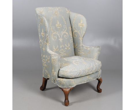 the outswept arms and bow front seat over carved cabriole legs, upholstered in raised chenille with an Adams style pattern, h