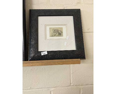 A pencil sketch of a nude lady, framed and glazed