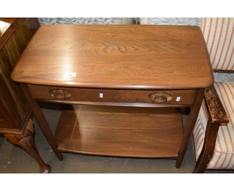 An Ercol single drawer side table with base shelf