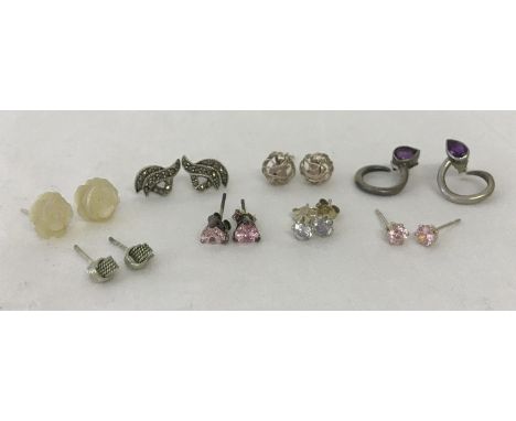 8 pairs of silver stud style earrings, some stone set.  To include amethyst set studs with twist design, marcasite set and ca