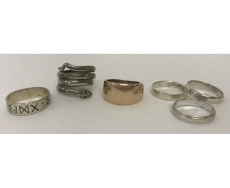 6 silver and white metal band style rings. To include a serpent design ring.   Total weight 23.7g.