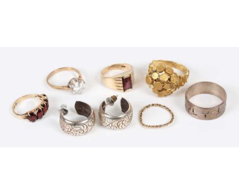 A 9ct gold and garnet five stone ring, claw set with oval cut garnets, Birmingham 1978, ring size approx J1/2, a 9ct gold rin