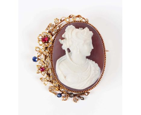 A German gold and agate cameo brooch, 19th century, carved as a portrait of a lady, mounted with a floral and foliate rose cu